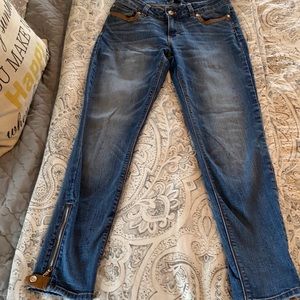 Medium wash tan leather trim jeans